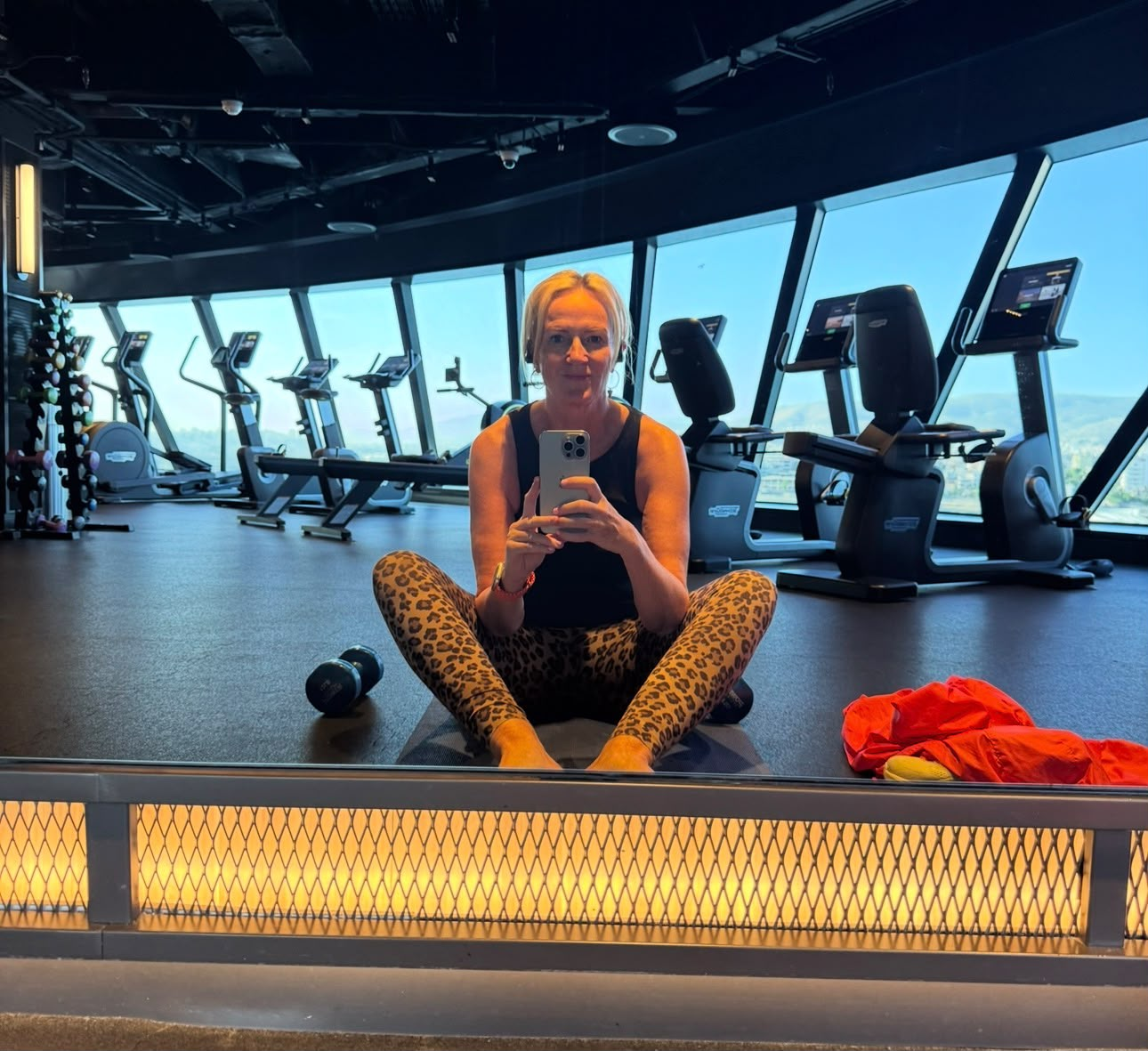 Jayne Crowley in a gym overlooking the sea